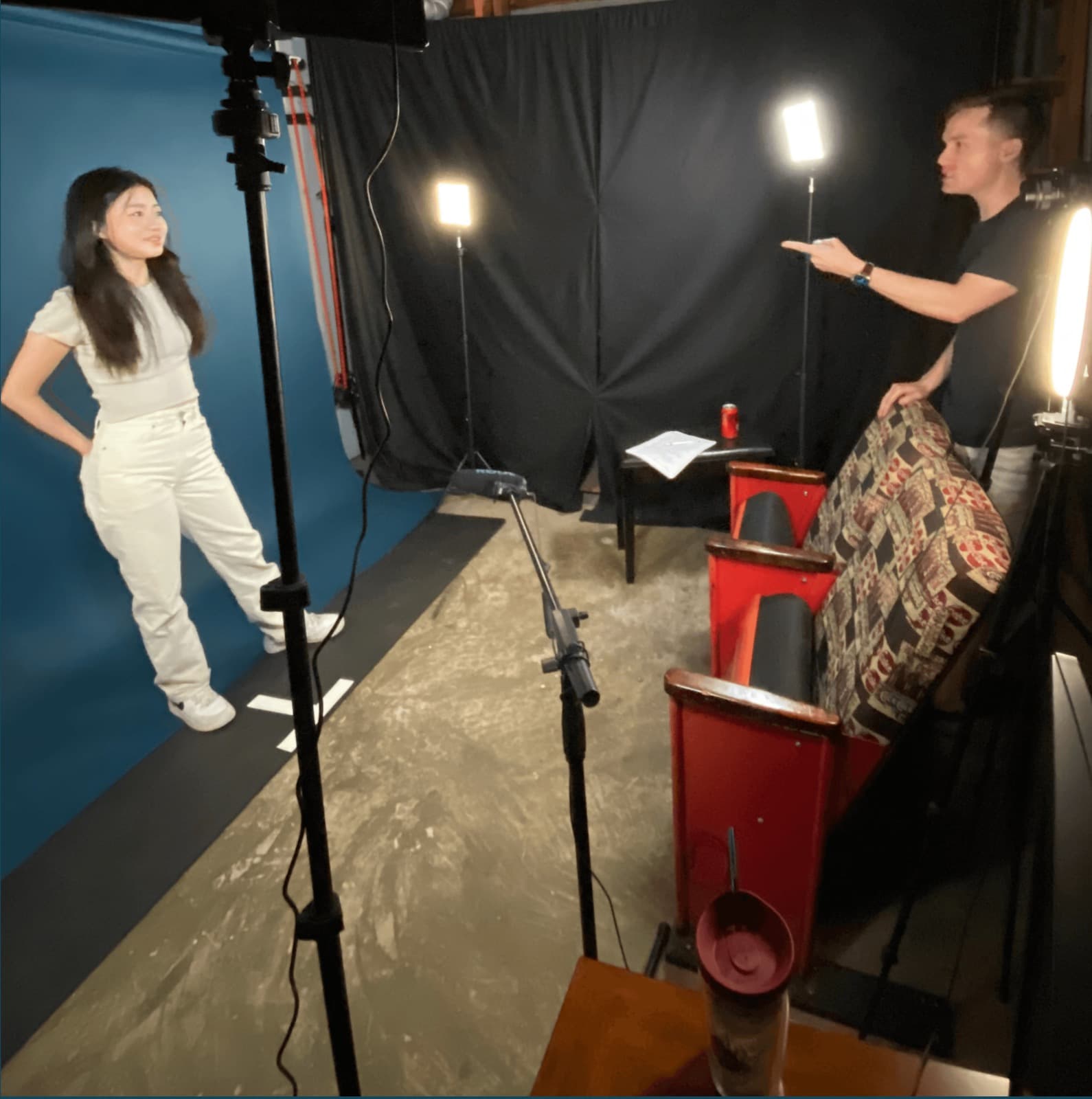 A University Prep student filming a prescreen while a coach directs